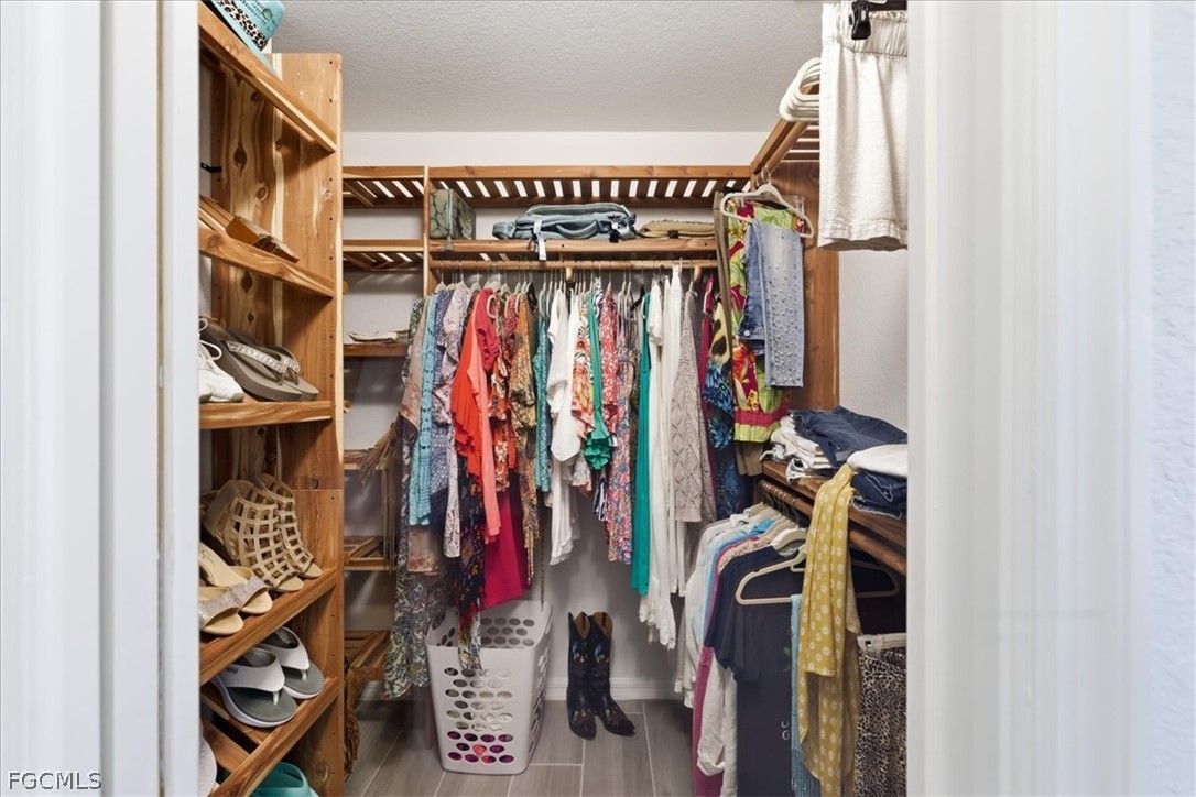 12 Idle Court Placida, FL 33946 - Photo 20 of 41 a view of walk in closet with clothes