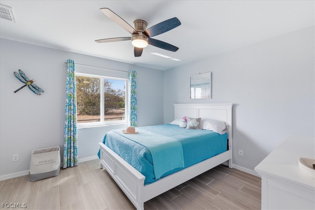 12 Idle Court Placida, FL 33946 - Photo 24 of 41 a bedroom with a large bed and a large window