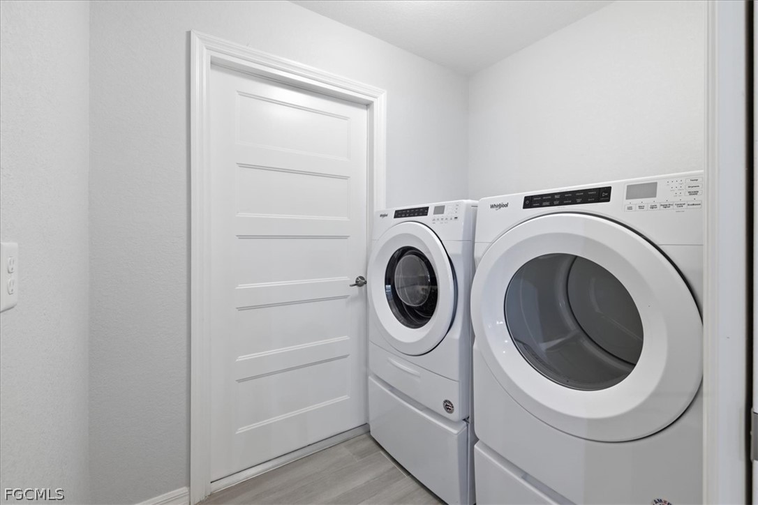 12 Idle Court Placida, FL 33946 - Photo 27 of 41 a utility room with dryer and washer