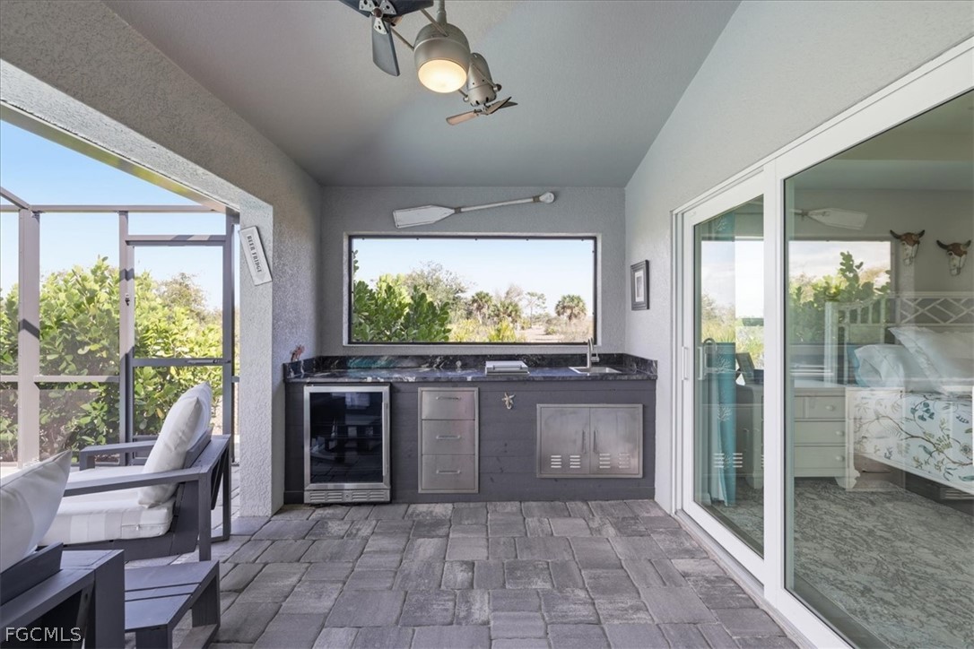 12 Idle Court Placida, FL 33946 - Photo 34 of 41 a kitchen with stainless steel appliances granite countertop a stove and a view of living room