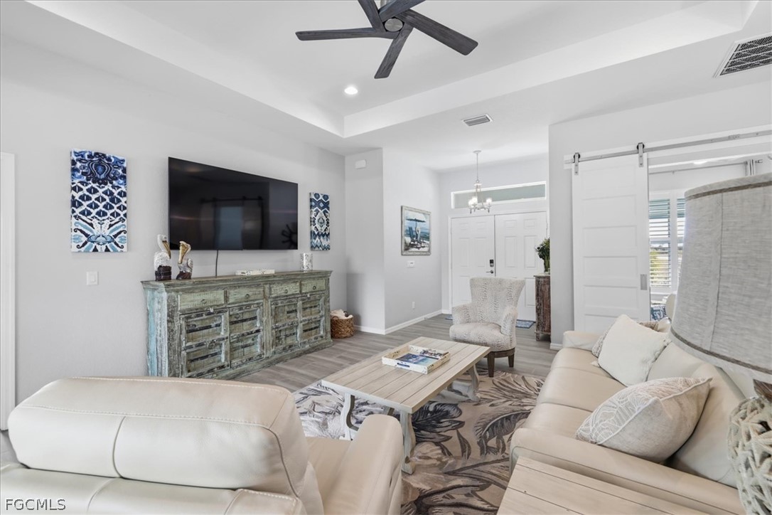 12 Idle Court Placida, FL 33946 - Photo 7 of 41 a living room with furniture and a flat screen tv