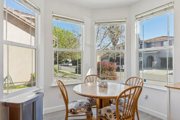 a view of a dining room with furniture window and outside view