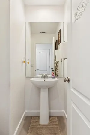 a bathroom with a sink and mirror