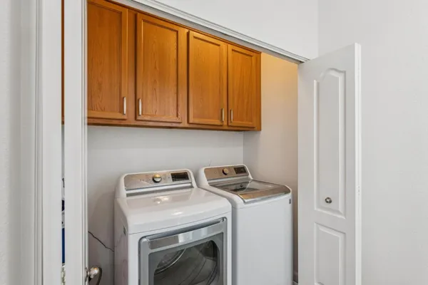 a utility room with dryer and washer