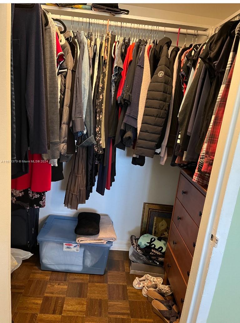 1300 Lincoln Road, Unit B302 Miami Beach, FL 33139 - Photo 14 of 14 a view of walk in closet with clothes and shoes