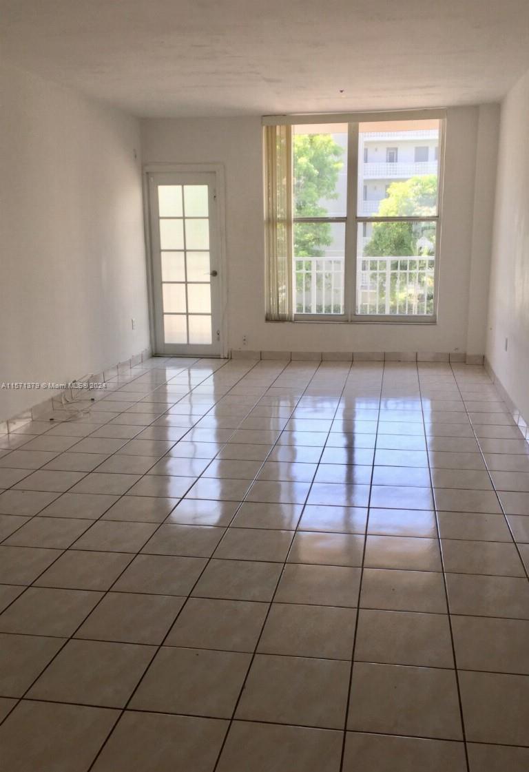 1300 Lincoln Road, Unit B302 Miami Beach, FL 33139 - Photo 3 of 14 a view of an empty room and window