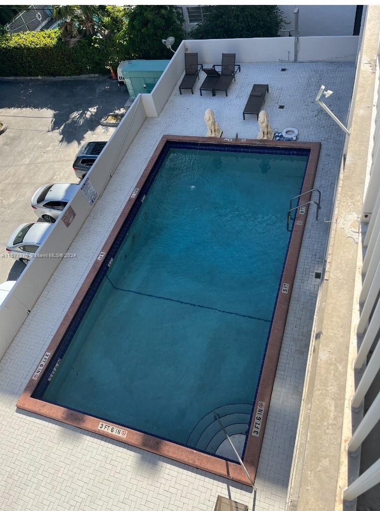 1300 Lincoln Road, Unit B302 Miami Beach, FL 33139 - Photo 8 of 14 a view of a two chairs in the balcony