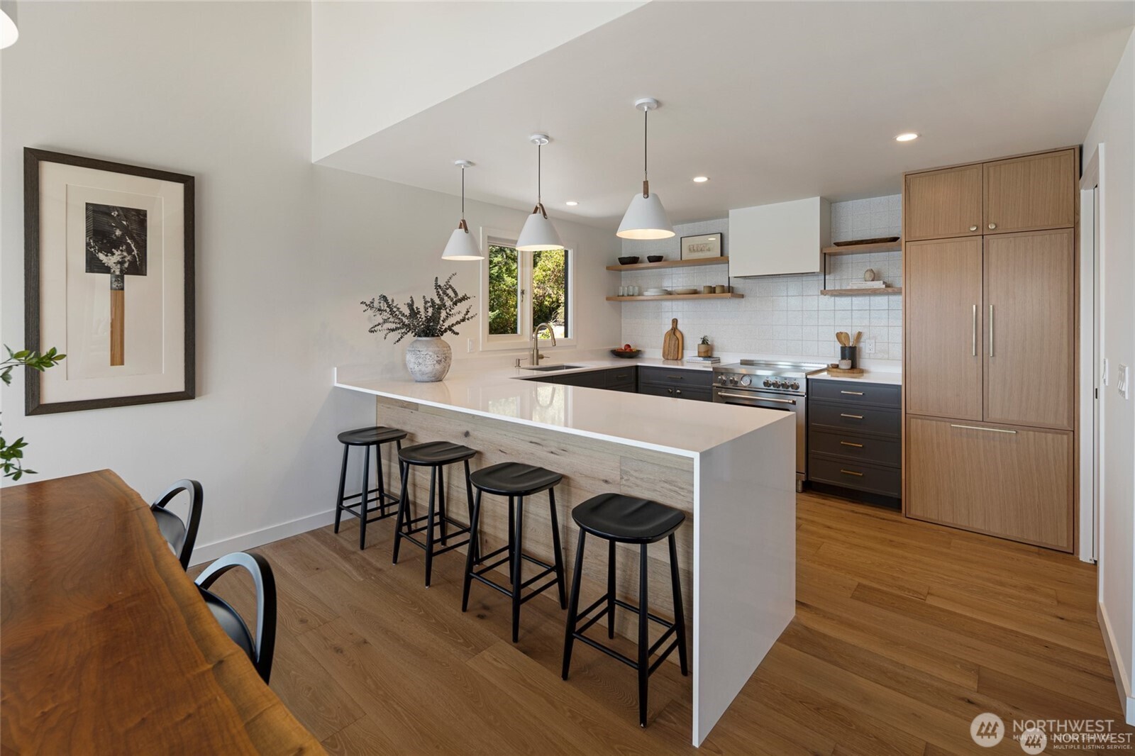 8256 Orcas Road Orcas Island, WA 98280 - Photo 6 of 20 a kitchen with kitchen island granite countertop a sink a center island stainless steel appliances and cabinets