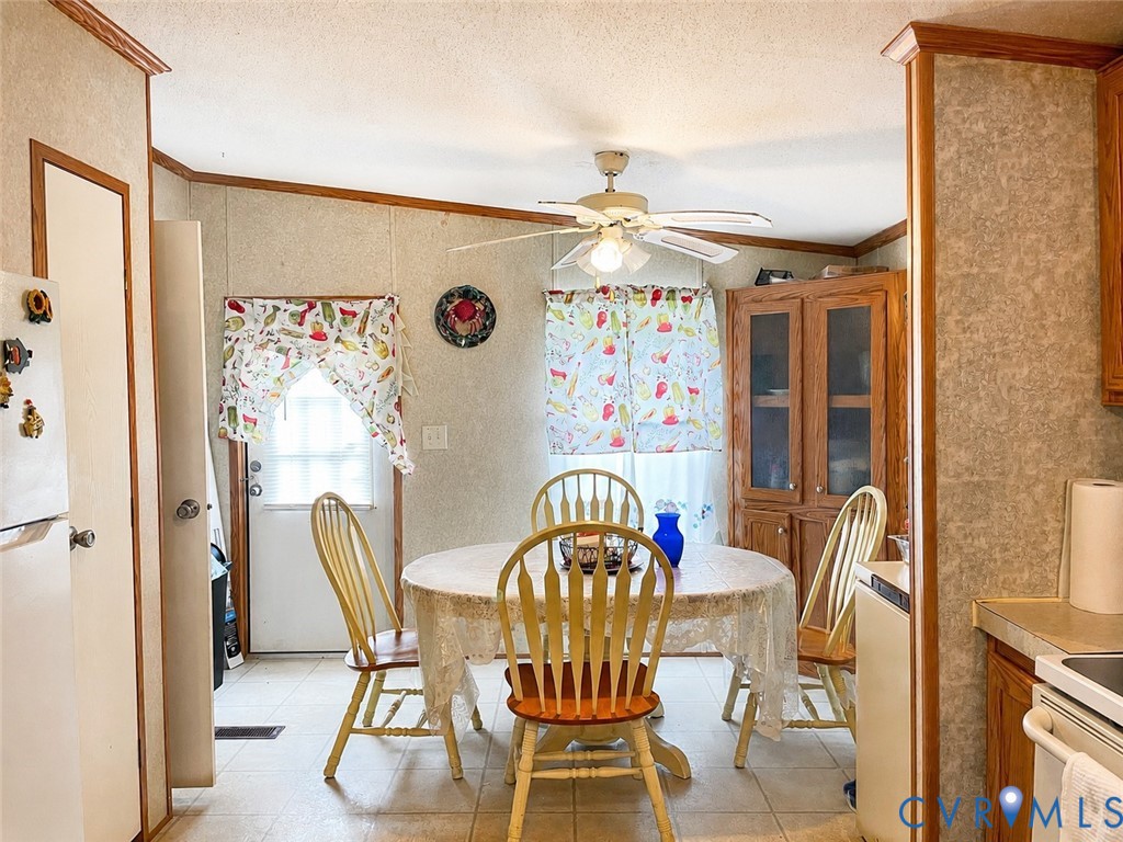 6873 Plank Road Kenbridge, VA 23944 - Photo 8 of 25 Dining area with tiled flooring, a ceiling fan, an