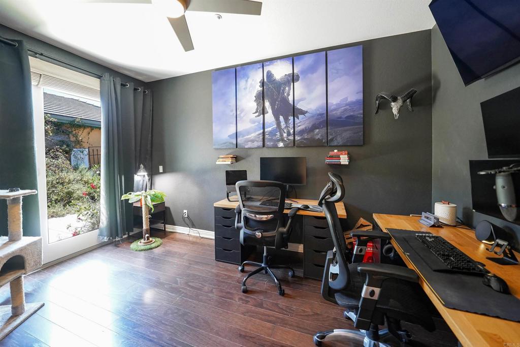 22963 Stokes Road Ramona, CA 92065 - Photo 39 of 57 a work room with furniture and wooden floor