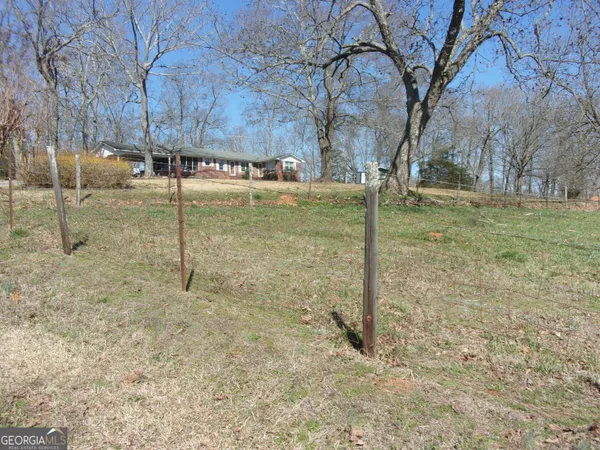 a view of a tree in front of a house