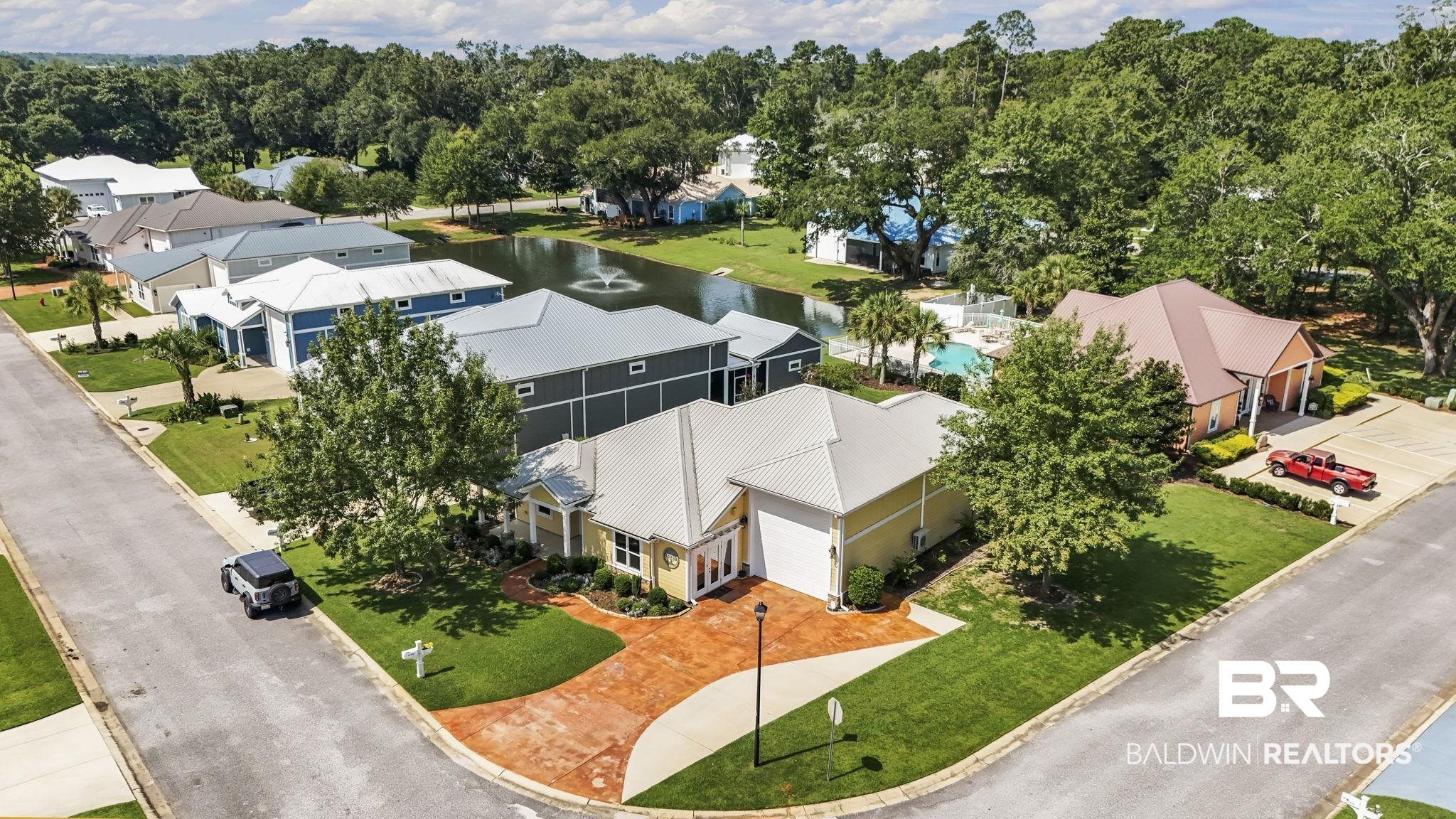 12361 Reunion Place Foley, AL 36535 - Photo 37 of 43 Aerial view of residential area featuring a nearby body of water