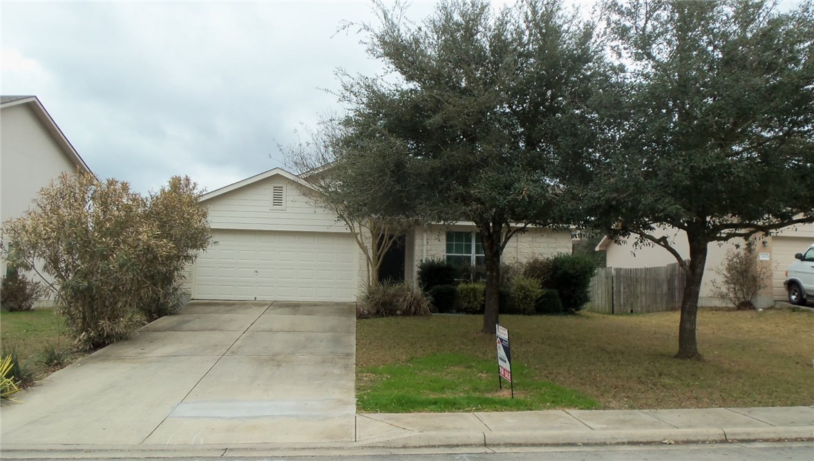 a backyard of a house with lots of trees