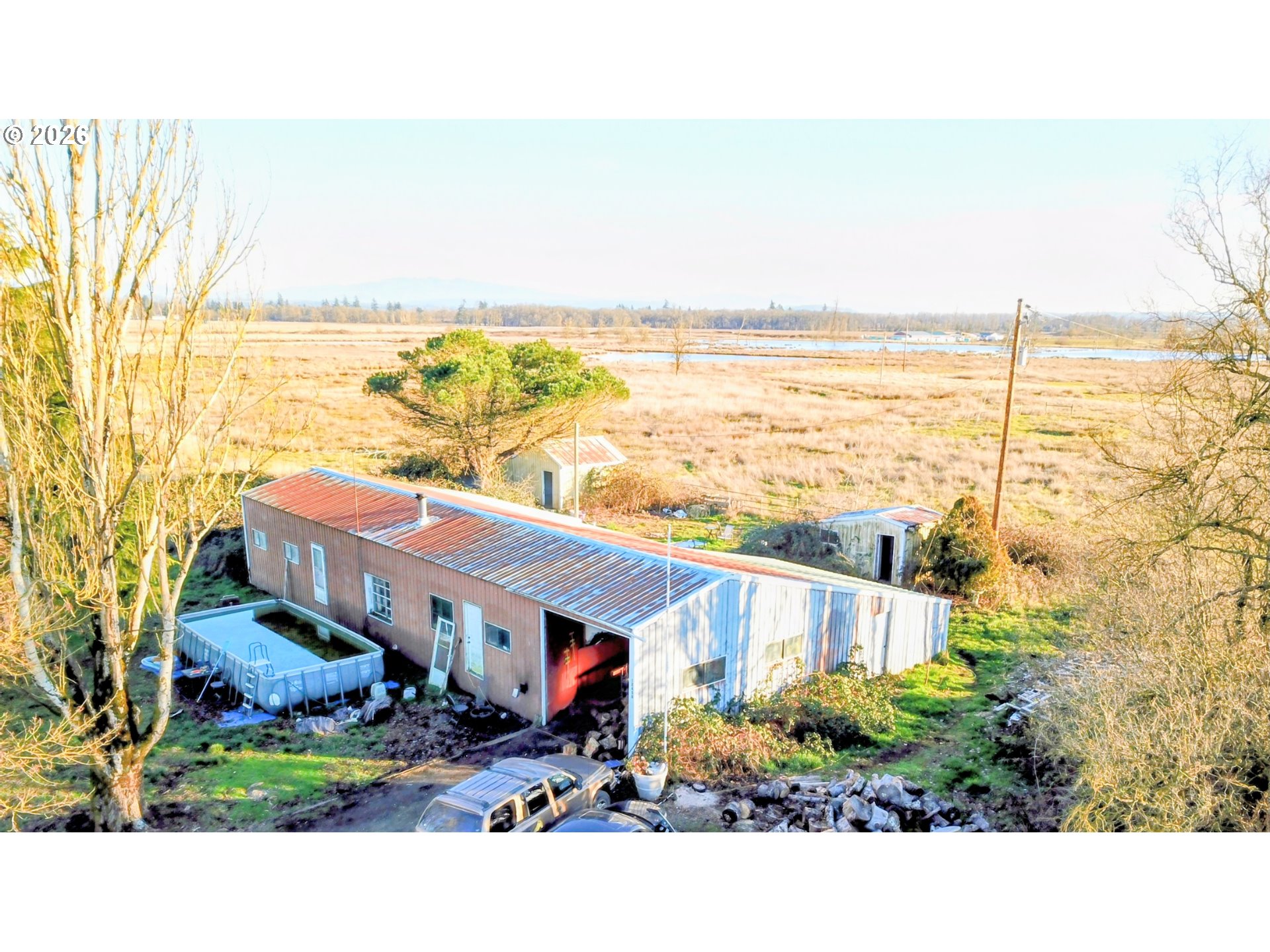 a view of a terrace with lawn chairs