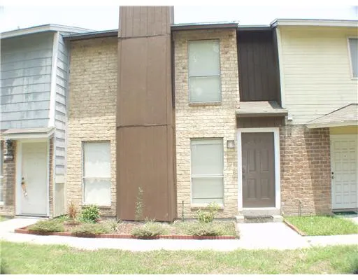 a front view of a house with yard