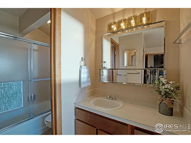 a bathroom with a sink double vanity and a mirror