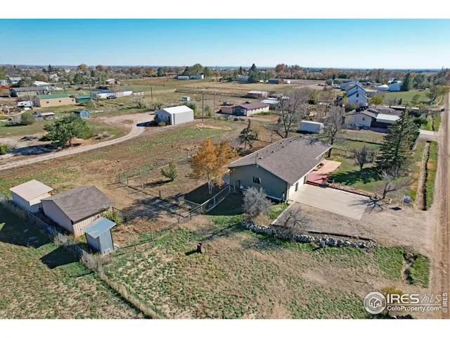 a view of a lake with lawn chairs