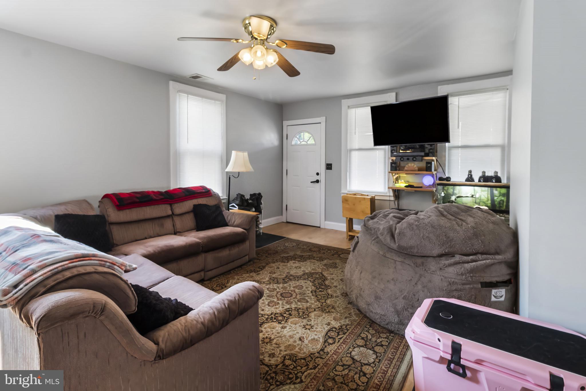 152 1/2 Rancocas Road Mount Holly, NJ 08060 - Photo 6 of 26 a living room with furniture and a flat screen tv