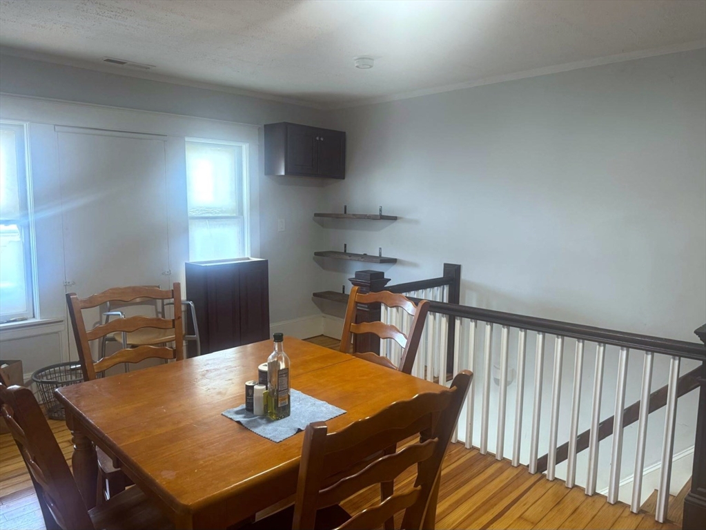 85 Seneca Street Lowell, MA 01852 - Photo 16 of 16 a view of a dining room with furniture and window