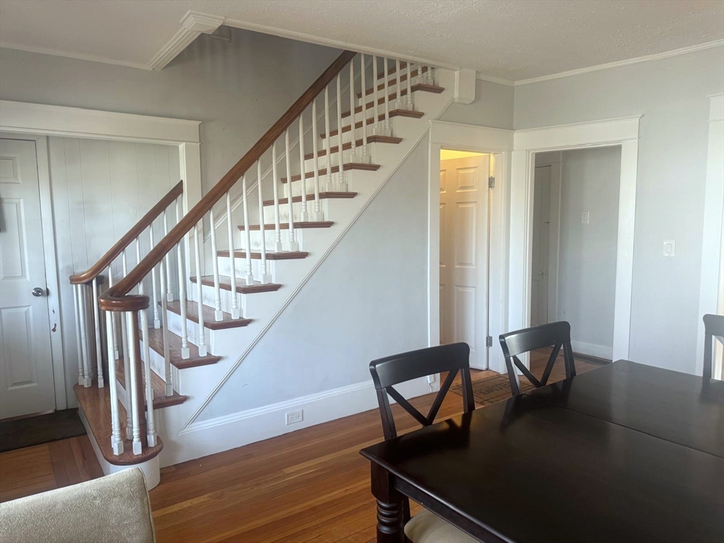 85 Seneca Street Lowell, MA 01852 - Photo 9 of 16 a view of livingroom with furniture and stairs