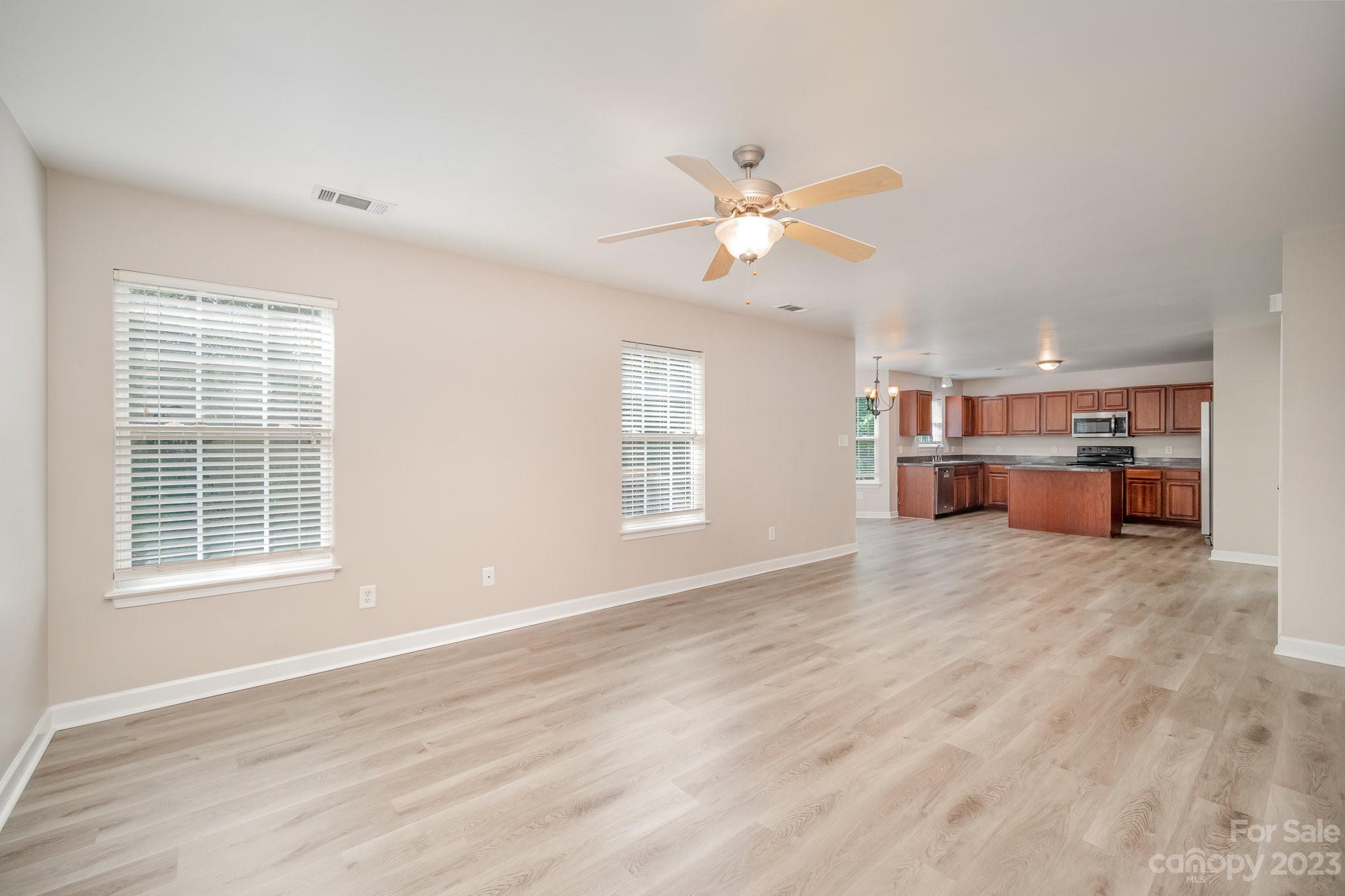 1400 Key Ridge Court Charlotte, NC 28216 - Photo 13 of 27 a view of empty room with wooden floor and window