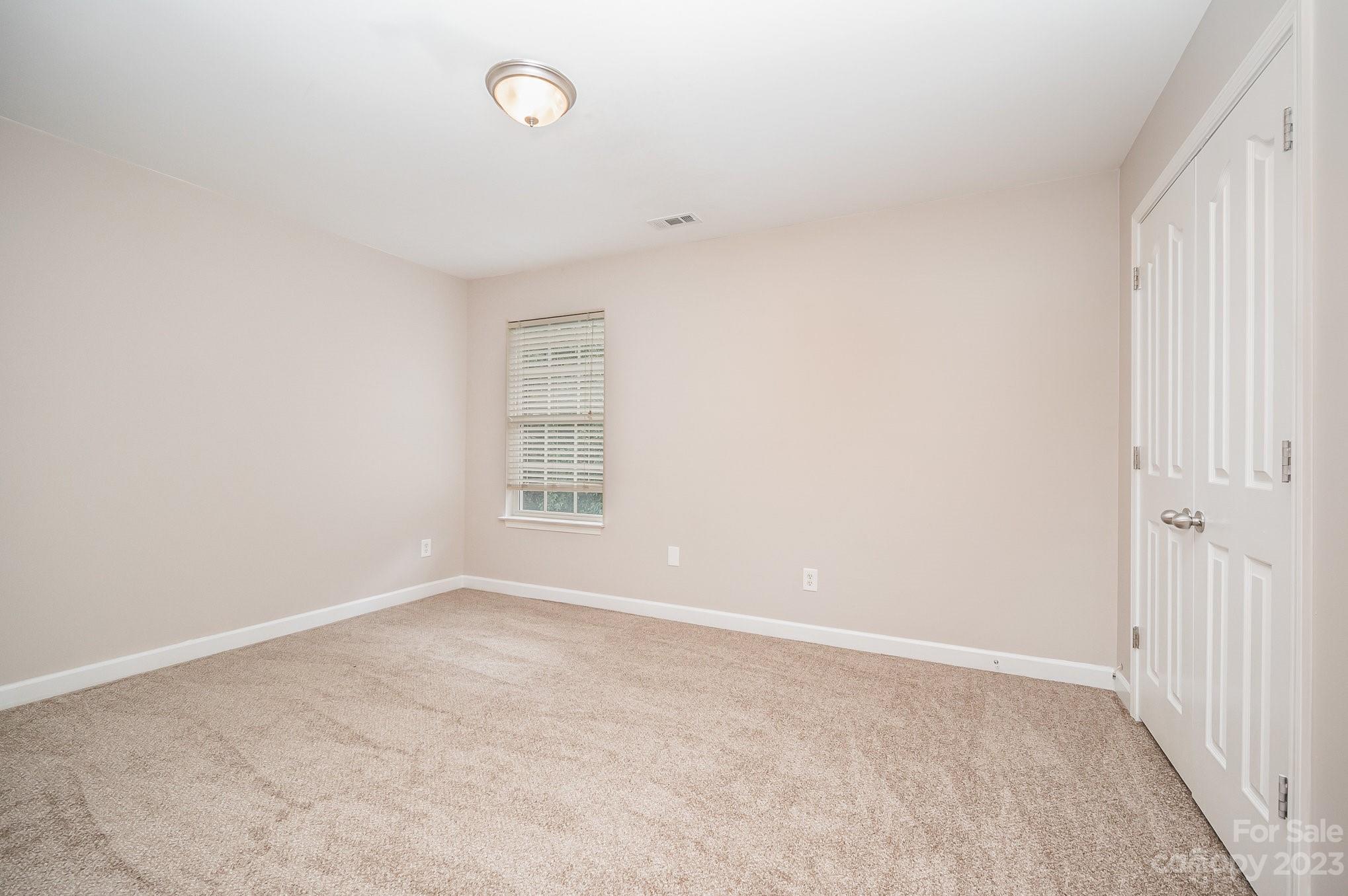 1400 Key Ridge Court Charlotte, NC 28216 - Photo 19 of 27 an empty room with windows
