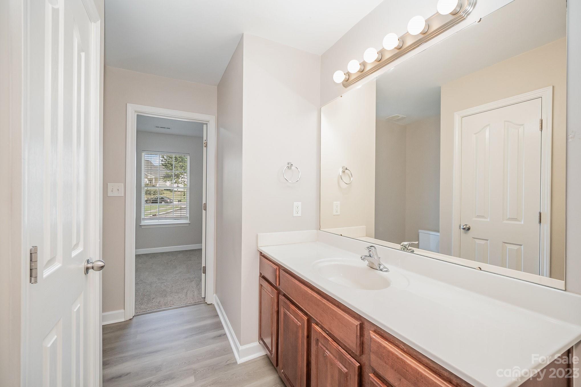 1400 Key Ridge Court Charlotte, NC 28216 - Photo 20 of 27 a bathroom with a sink double vanity and a mirror