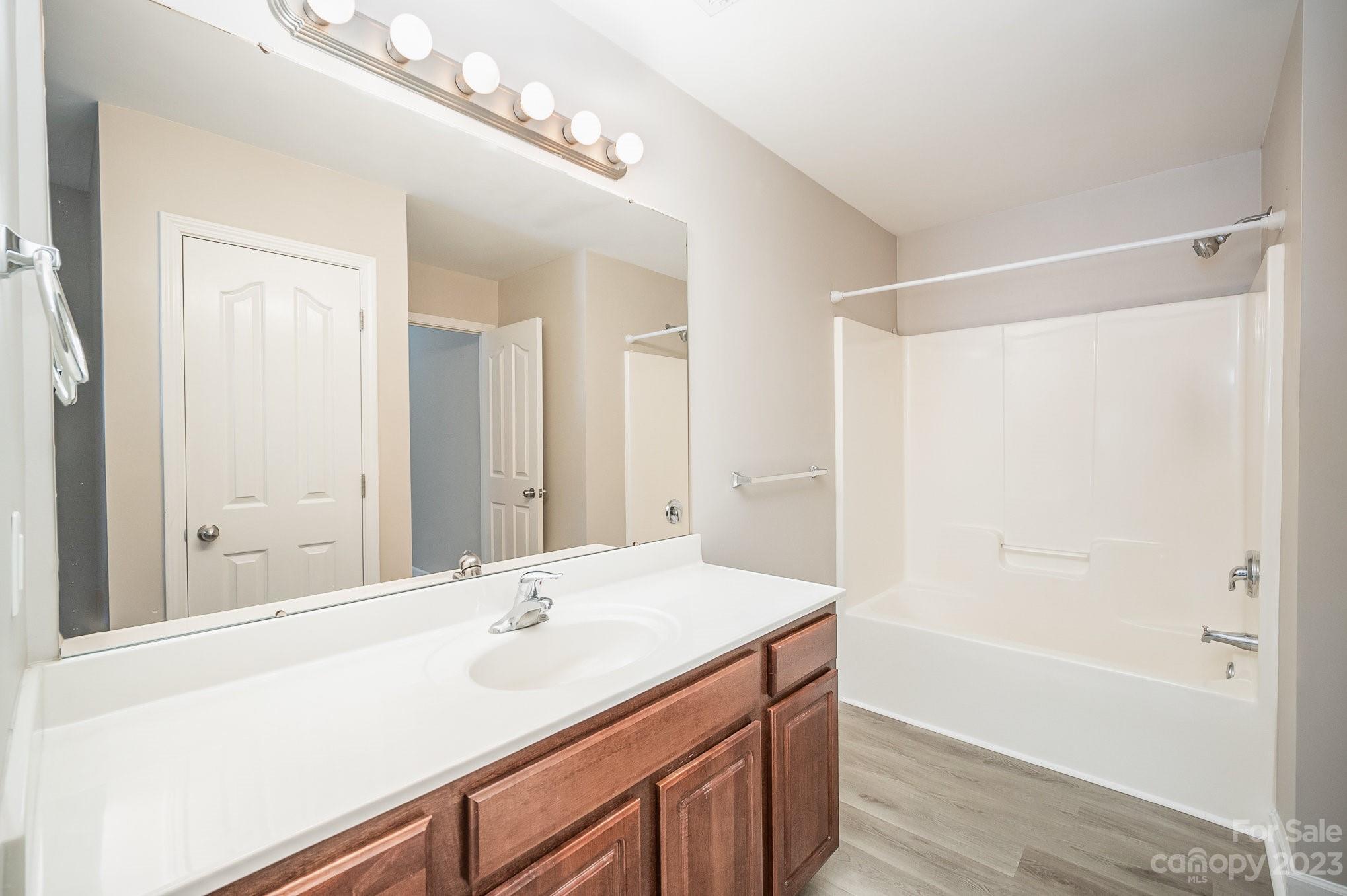 1400 Key Ridge Court Charlotte, NC 28216 - Photo 23 of 27 a bathroom with a double vanity sink and a mirror
