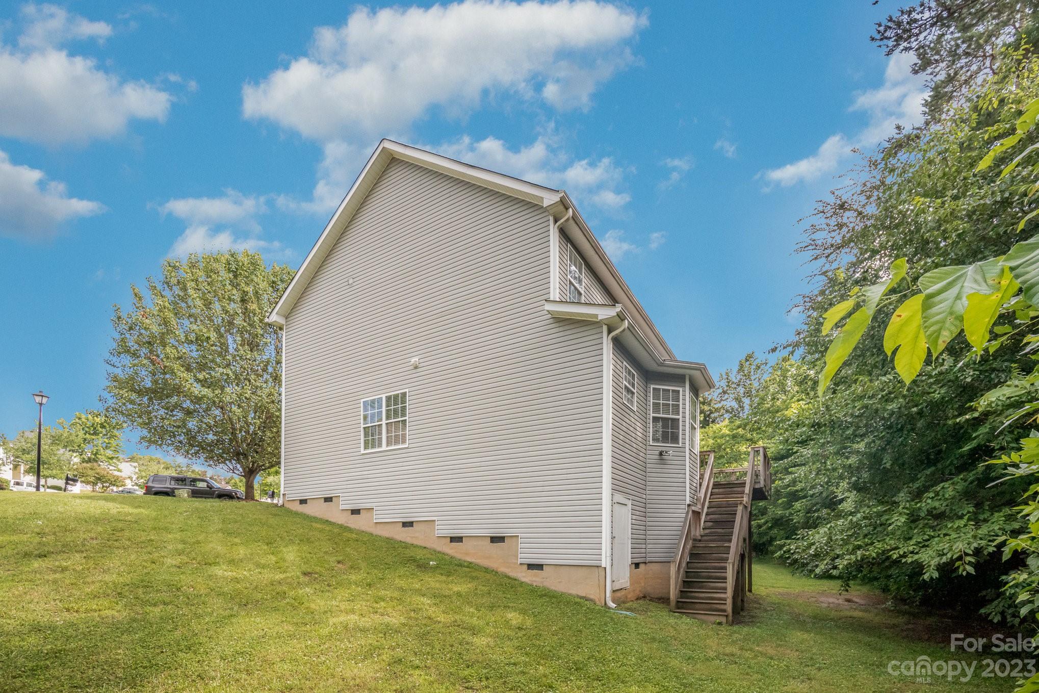 1400 Key Ridge Court Charlotte, NC 28216 - Photo 26 of 27 a view of an house with backyard space and garden