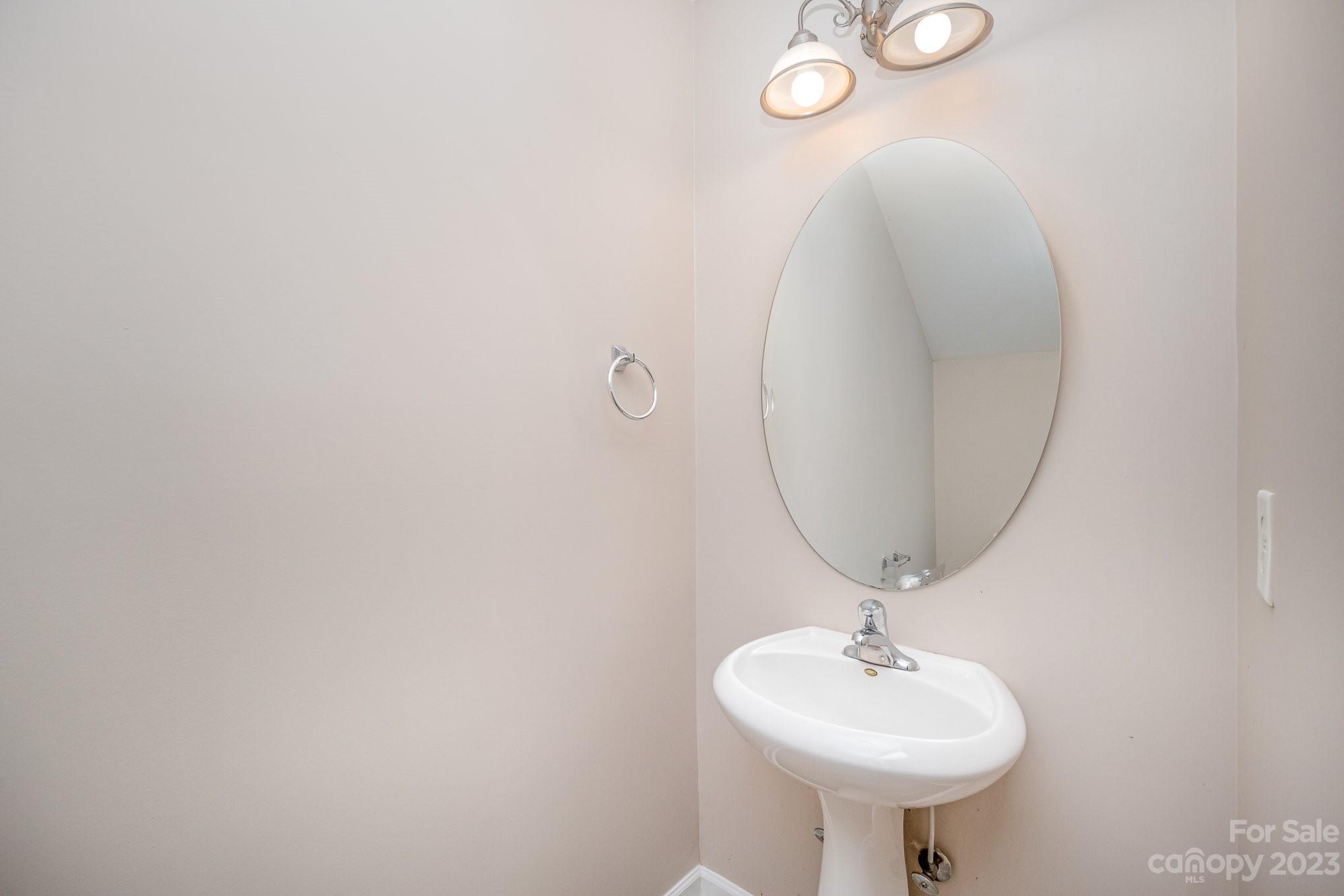 1400 Key Ridge Court Charlotte, NC 28216 - Photo 6 of 27 a bathroom with a sink and a mirror