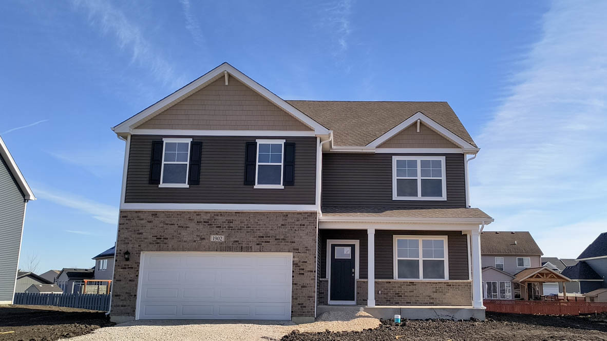 1822 Overland Drive Plainfield, IL 60586 - Photo 1 of 21 a front view of a house with yard