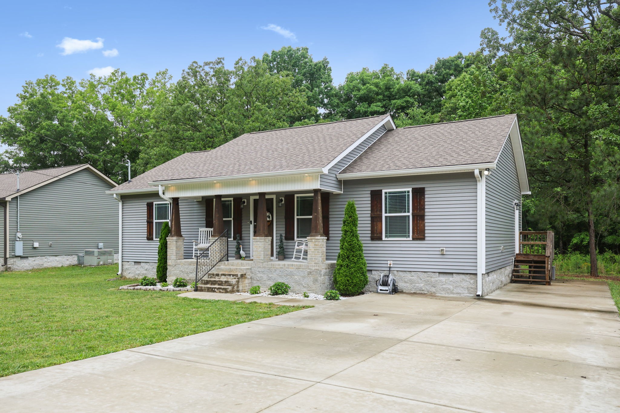 1546 South Spring Street Manchester, TN 37355 - Photo 3 of 53 a front view of a house with a garden and plants