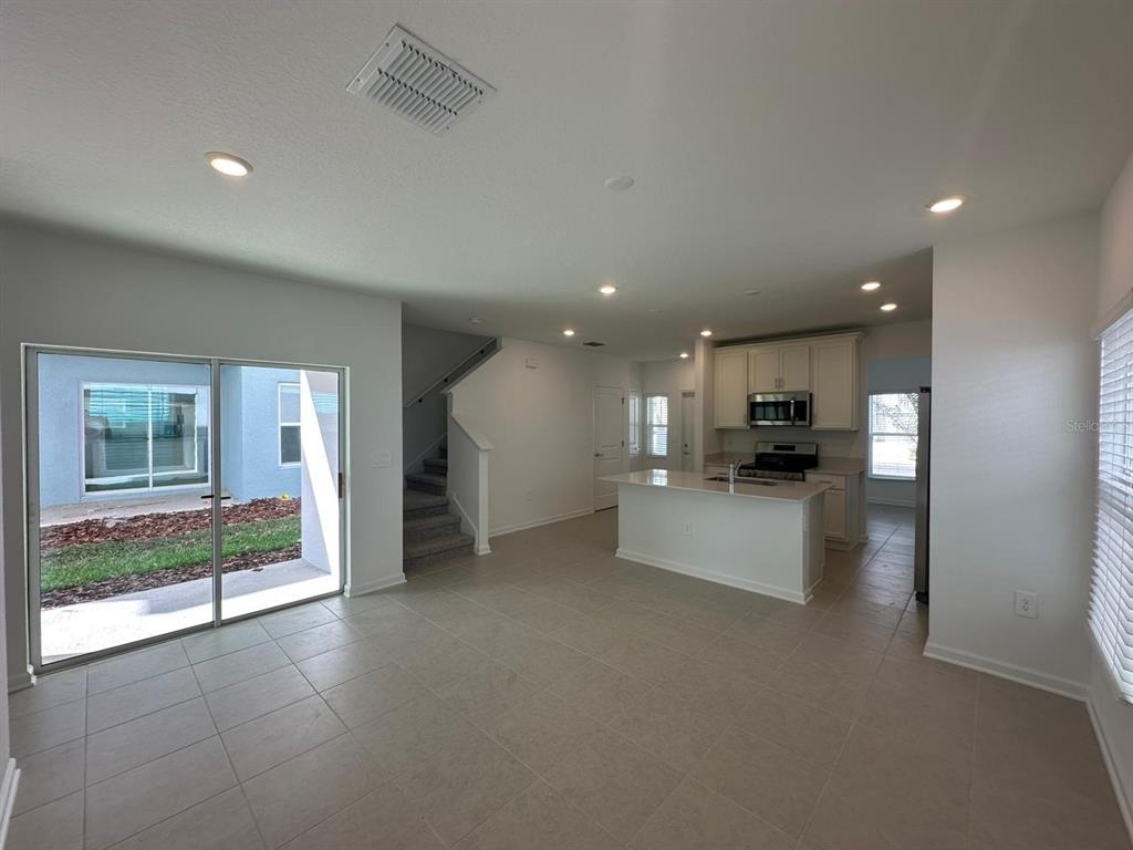 6000 Zen Way Clermont, FL 34714 - Photo 3 of 8 a view of kitchen with refrigerator and window