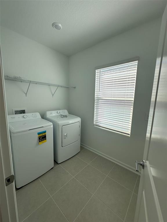 6000 Zen Way Clermont, FL 34714 - Photo 5 of 8 a utility room with dryer and washer