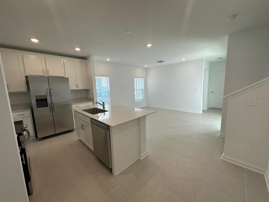 6000 Zen Way Clermont, FL 34714 - Photo 8 of 8 a kitchen with stainless steel appliances a refrigerator and a stove