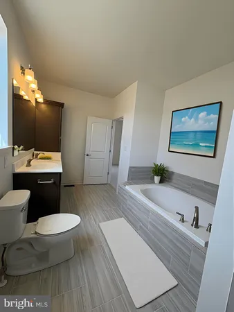 a room with a bed furniture and mirror