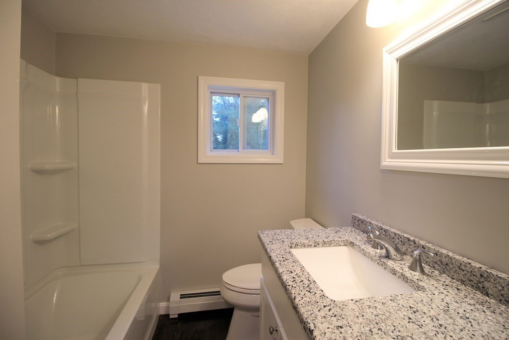 61 Chipaway Road Freetown, MA 02717 - Photo 13 of 27 a bathroom with a granite countertop sink toilet and shower