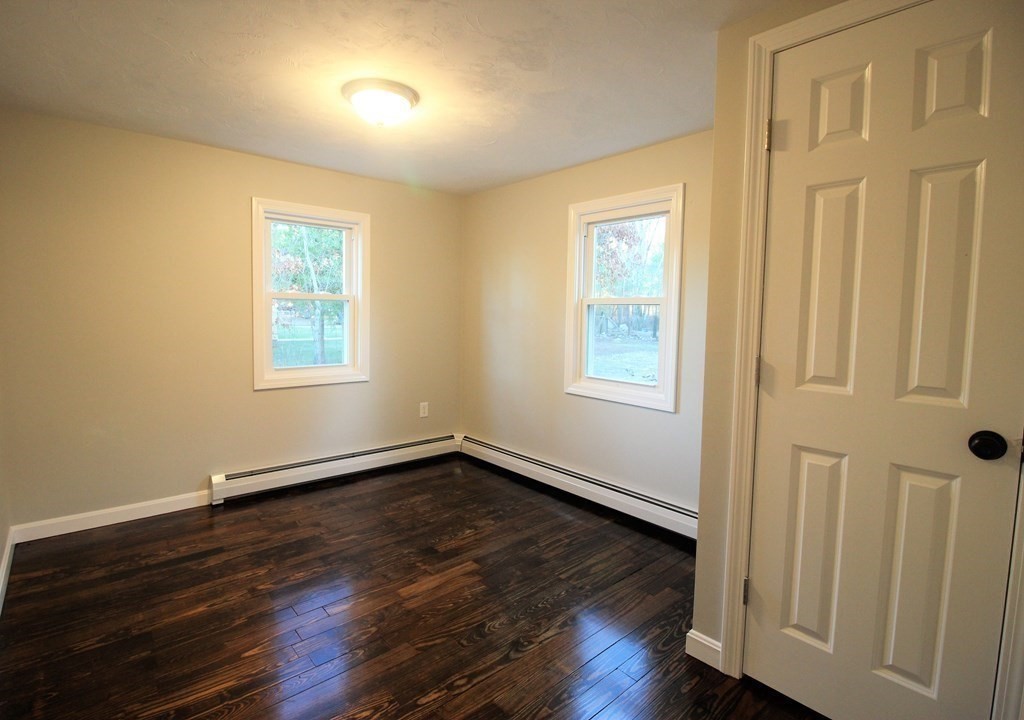61 Chipaway Road Freetown, MA 02717 - Photo 14 of 27 a view of an empty room with wooden floor and a window