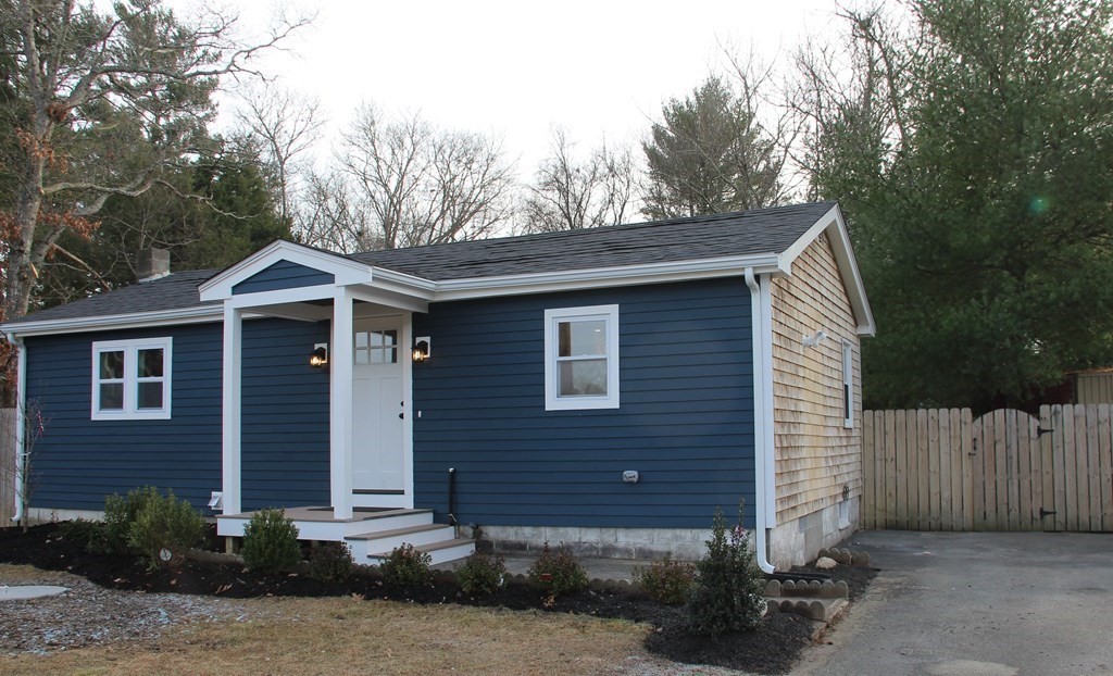 61 Chipaway Road Freetown, MA 02717 - Photo 2 of 27 a front view of a house with a yard