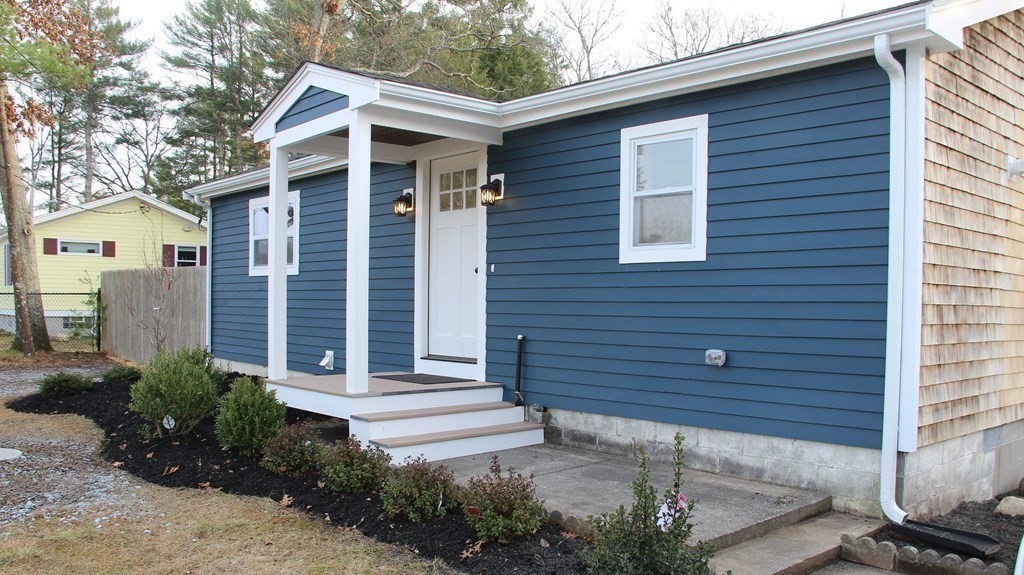 61 Chipaway Road Freetown, MA 02717 - Photo 22 of 27 a front view of a house with a garden