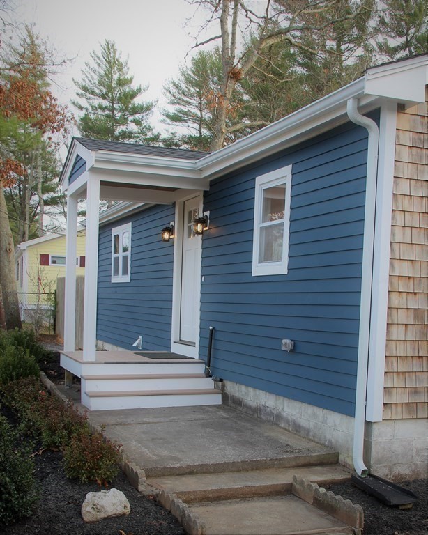 61 Chipaway Road Freetown, MA 02717 - Photo 23 of 27 a front view of a house with garden