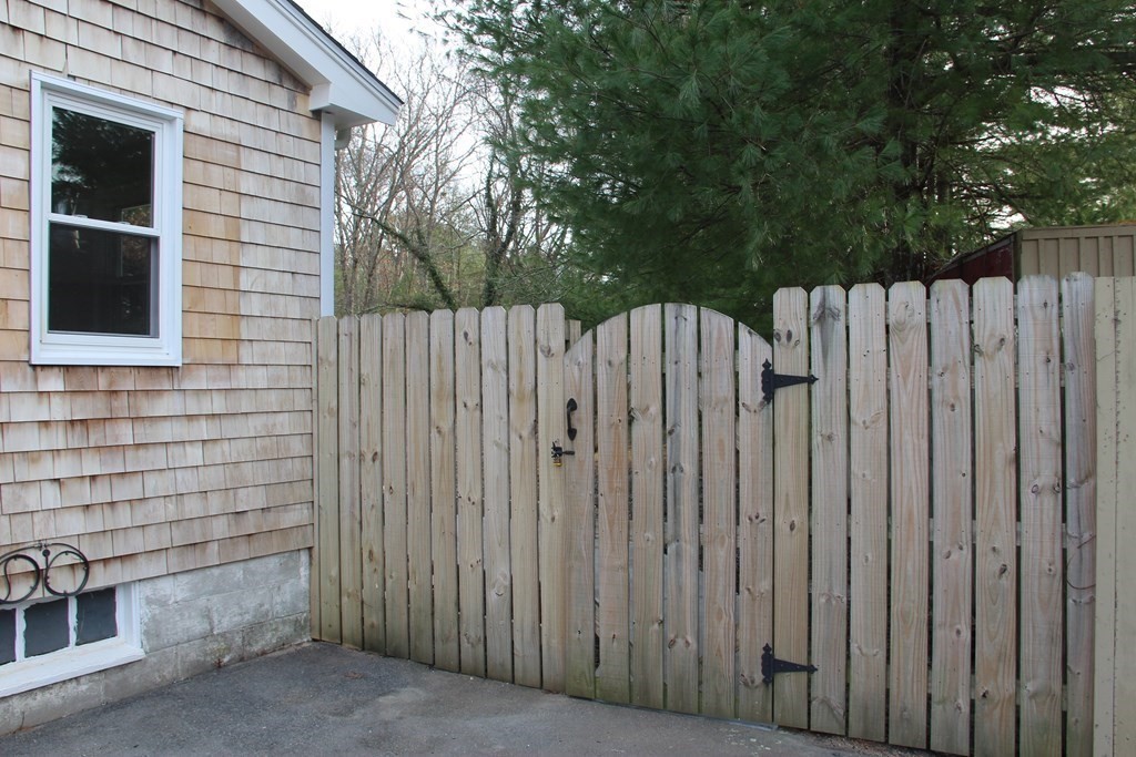61 Chipaway Road Freetown, MA 02717 - Photo 24 of 27 a view of a backyard with wooden fence
