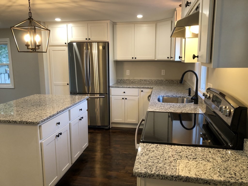 61 Chipaway Road Freetown, MA 02717 - Photo 6 of 27 a kitchen with stainless steel appliances granite countertop a sink stove and refrigerator