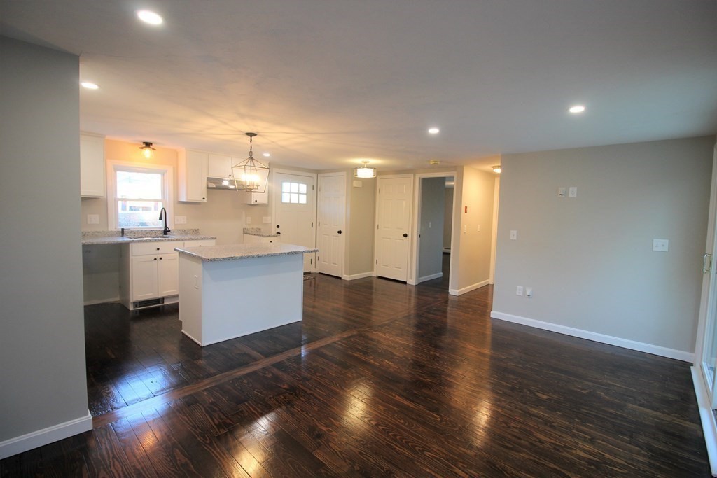 61 Chipaway Road Freetown, MA 02717 - Photo 9 of 27 a large kitchen with stainless steel appliances granite countertop a large counter top and a wooden floor