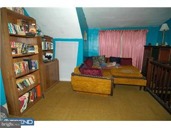 810 Angora Road Reading, PA 19606 - Photo 8 of 11 a living room with furniture and a book shelf