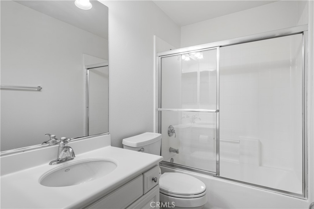 61 Bellwind Irvine, CA 92603 - Photo 15 of 23 a bathroom with a sink toilet and shower