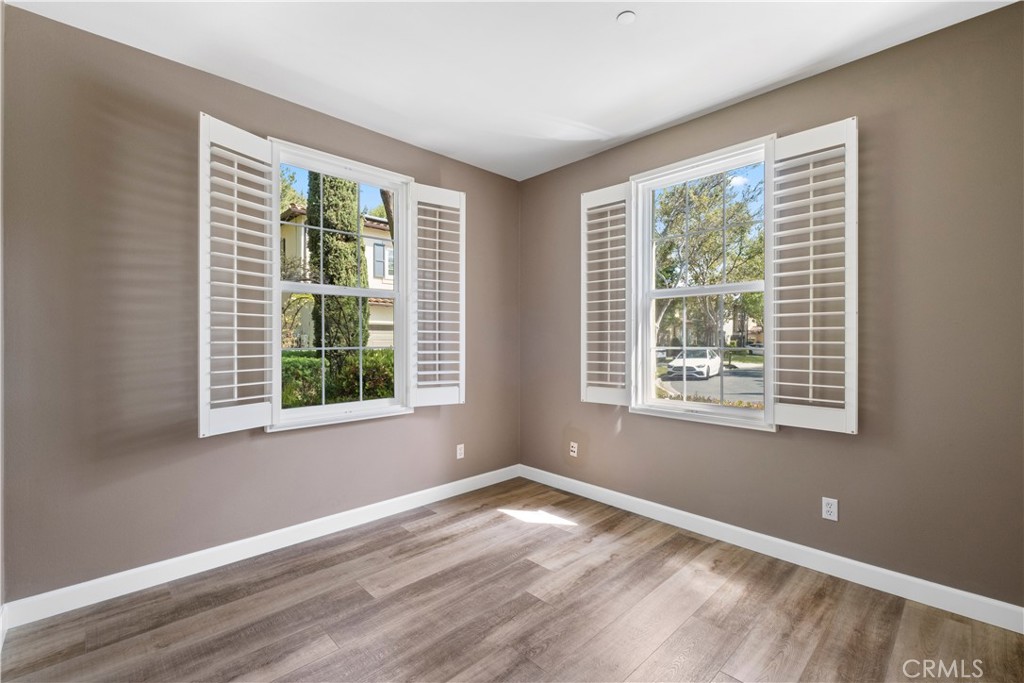 61 Bellwind Irvine, CA 92603 - Photo 10 of 23 a view of empty room with wooden floor and fan