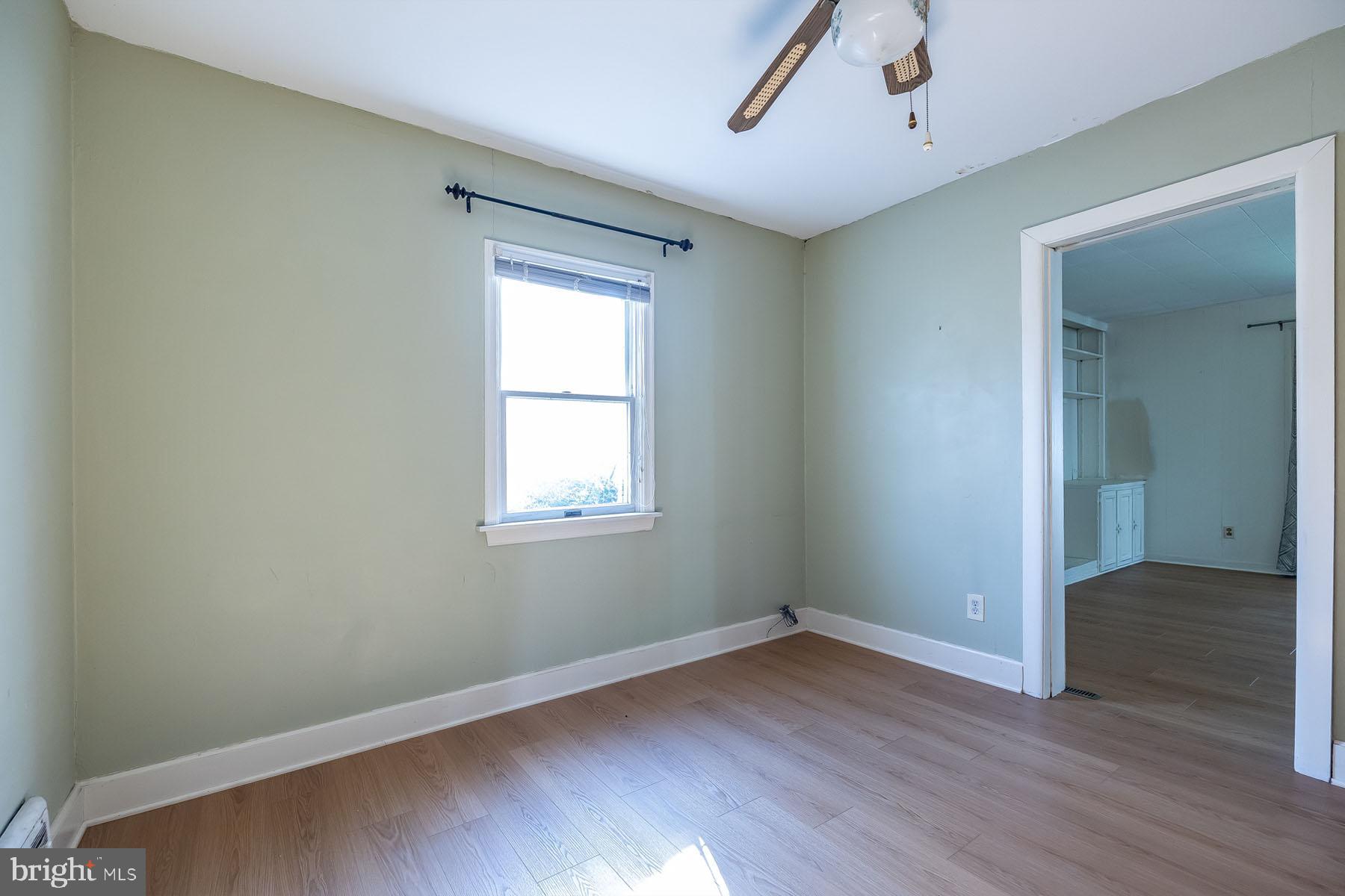 1520 Chestnut Avenue Haddon Heights, NJ 08035 - Photo 18 of 33 an empty room with wooden floor and windows