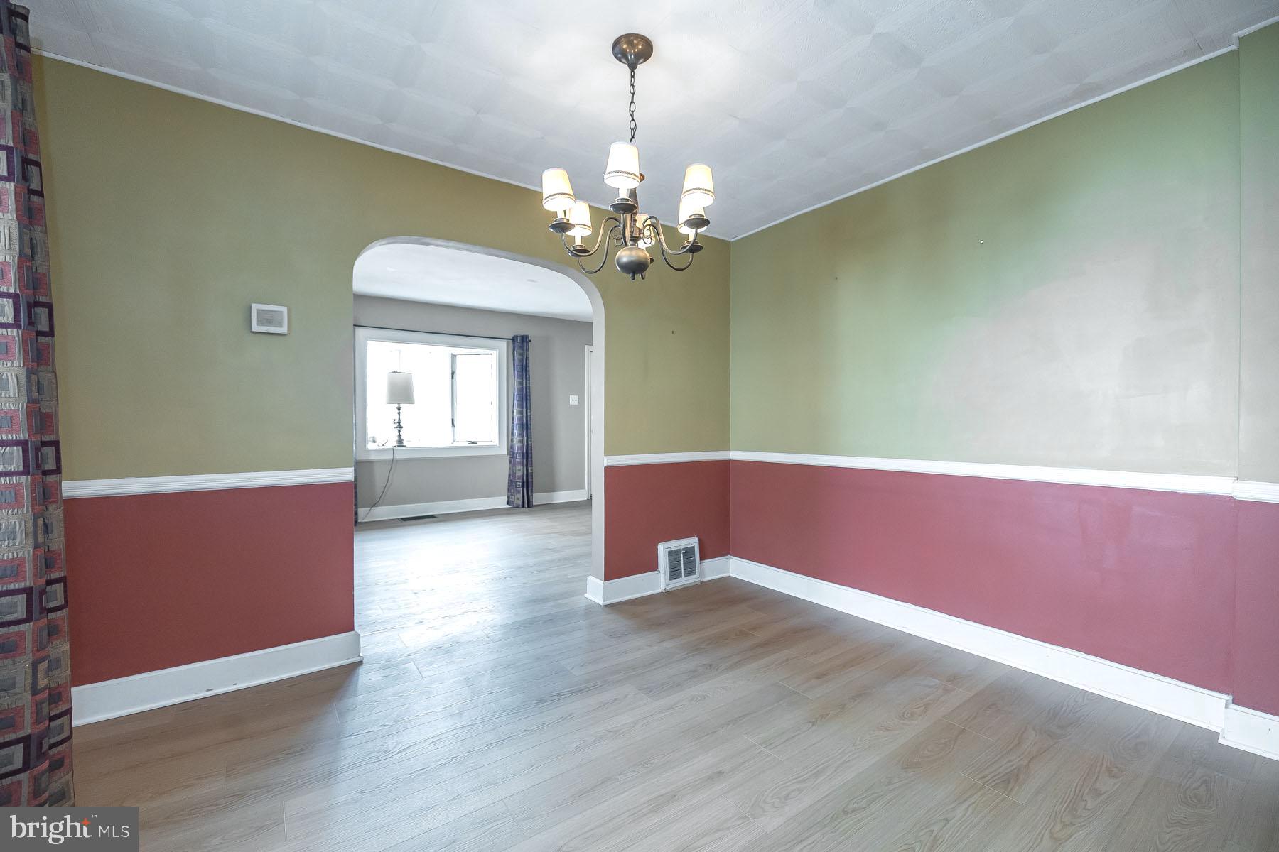1520 Chestnut Avenue Haddon Heights, NJ 08035 - Photo 10 of 33 a view of an empty room with chandelier and wooden floor