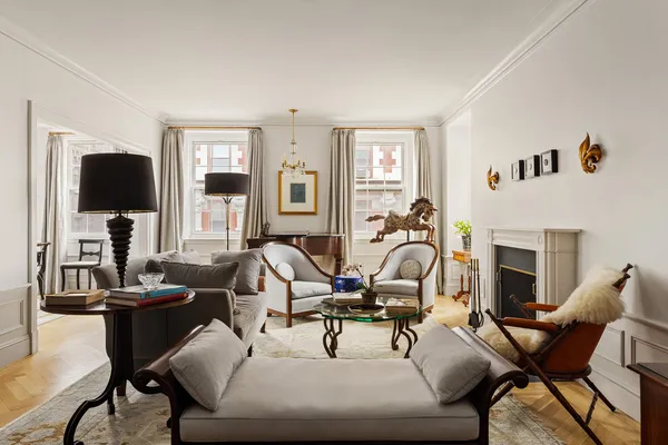 a view of a livingroom with wooden floor and a potted plant
